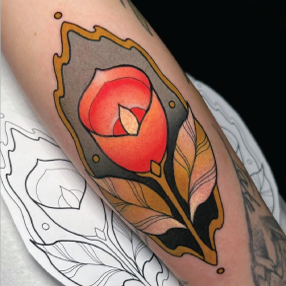 Neo traditional tattoo of a pink flower with a yellow and green stem in front of a grey frame